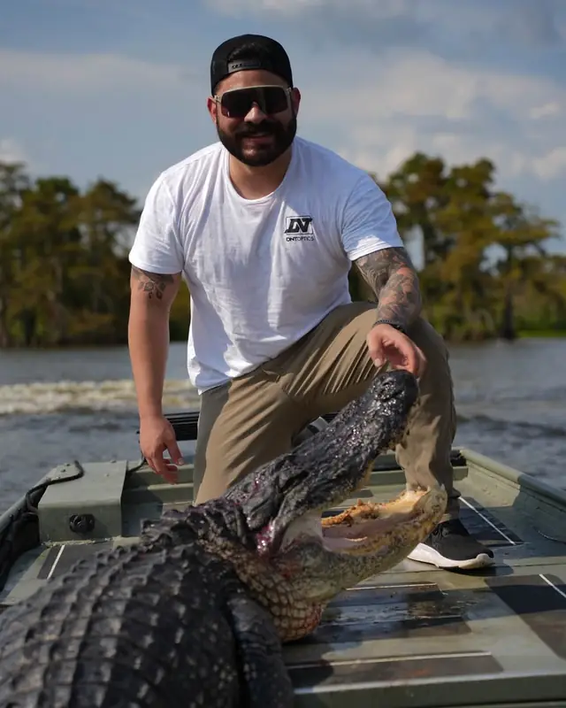 Alligator being landed on a baited line during a guided Louisiana hunt