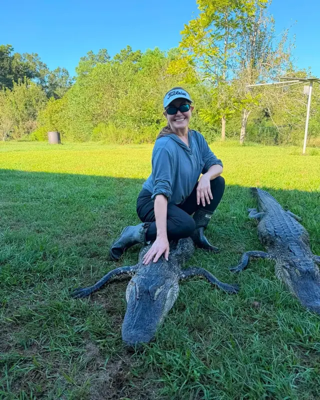 Hunter with two alligators taken on the same guided trip